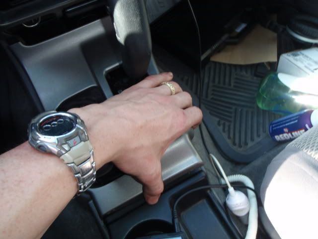 Pull off the center shift console panel